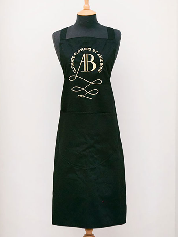 amie bone signature black apron with gold embroidery