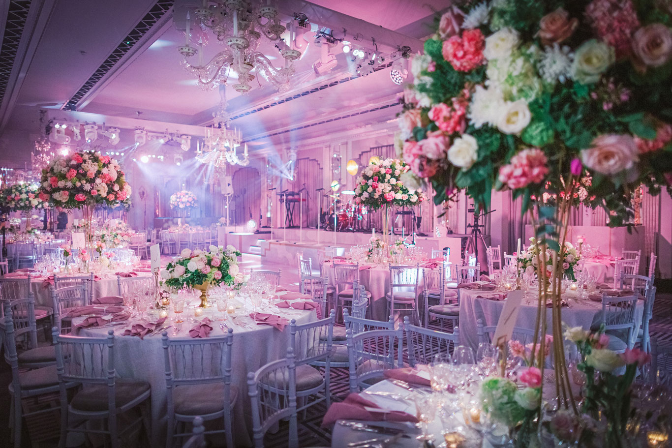 decorated wedding tables with floral and candle arrangements in Claridge's Hotel