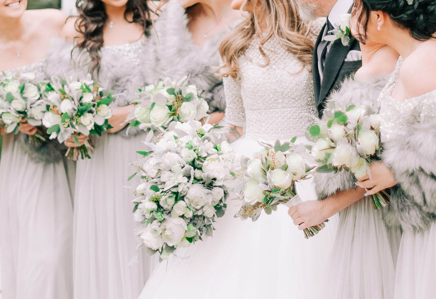 bride and her bridesmaids with their bridal and bridal party bouquets