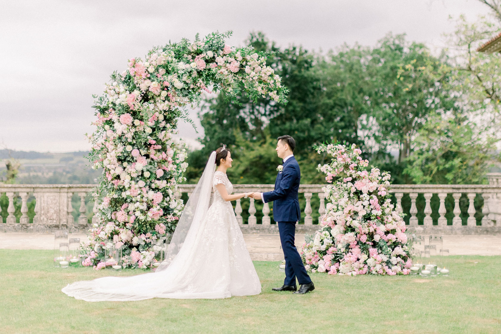 a candlelit wedding in a marquee with hanging florals